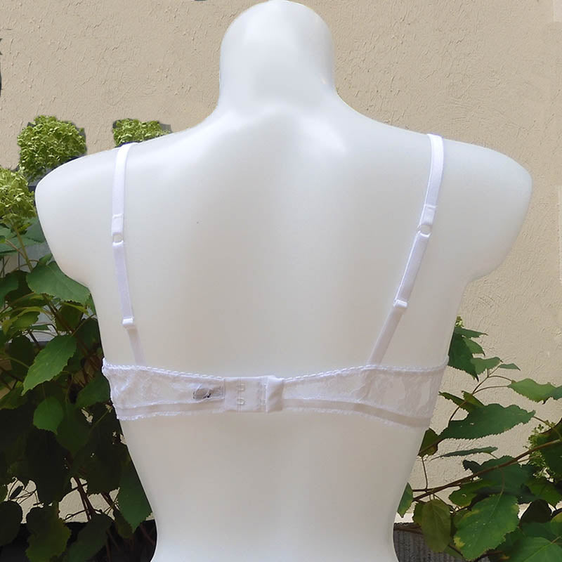 Weißes Bralette ohne Bügel aus durchsichtiger Spitze und mit braun-weißer Rüschenbortre verzierte Cups von fishbelly Lingerie handmade in Berlin - Rückansicht