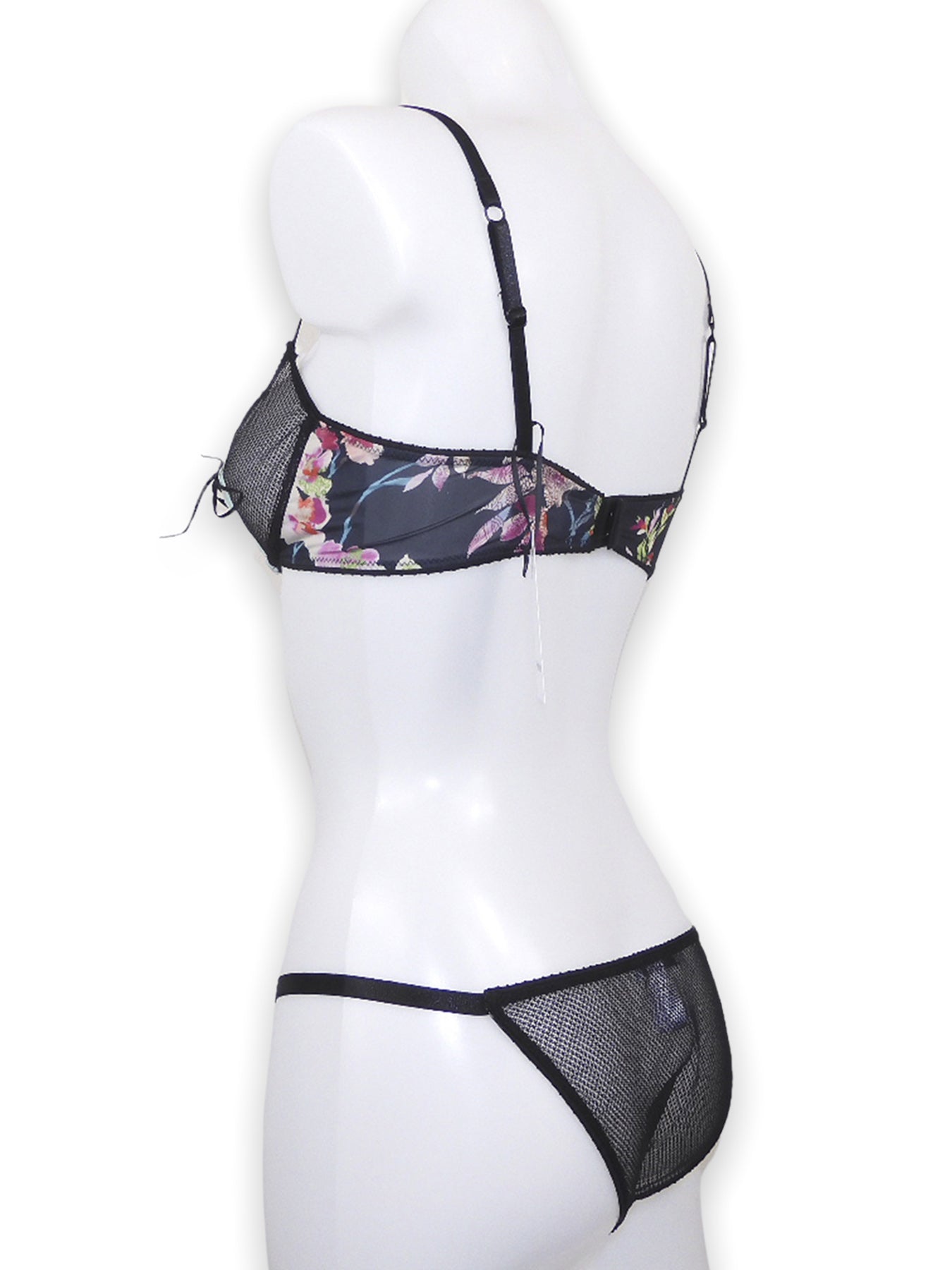 Offener Bügel BH ouvert aus schwarzem Mesh in Kombination mit türkiser Borte und floralem Print mit passendem Tanga-Slip ouvert seitliche Ansicht - fishbelly Lingerie handmade in Berlin