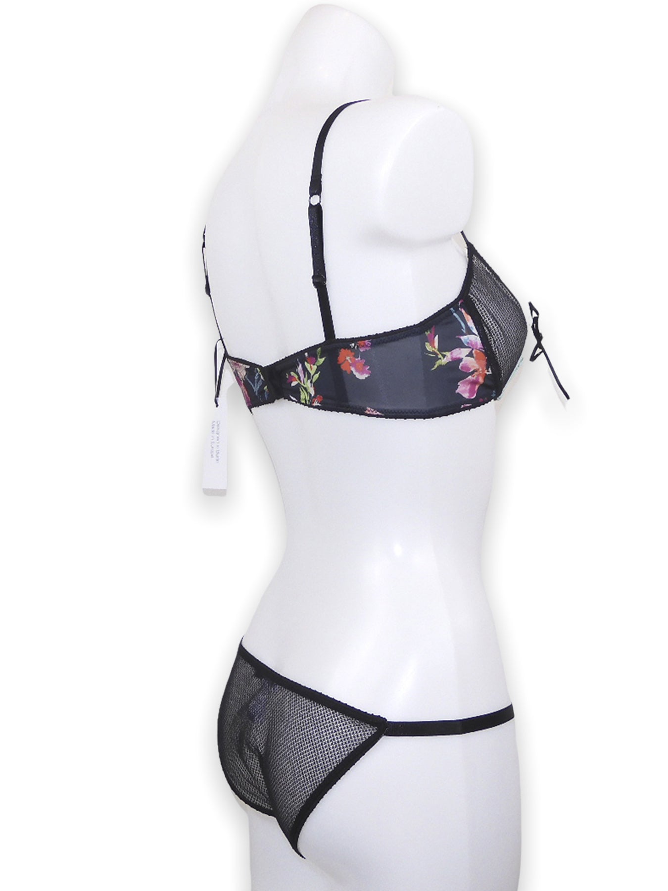 Offener Bügel BH ouvert aus schwarzem Mesh in Kombination mit türkiser Borte und floralem Print mit passendem Tanga-Slip ouvert  seitliche Ansicht- fishbelly Lingerie handmade in Berlin
